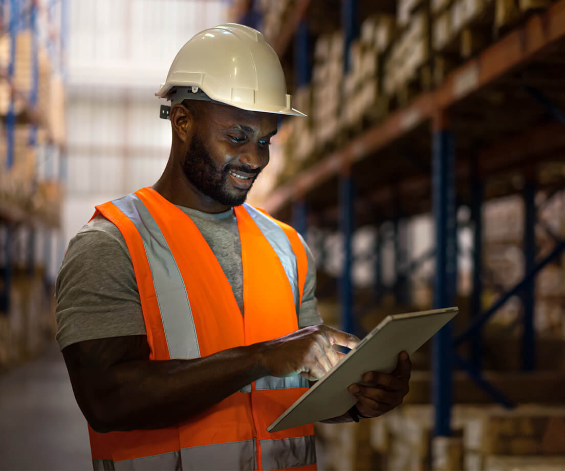 Warehouse worker checking tablet